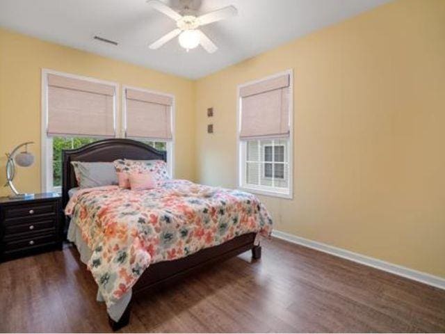 bedroom featuring dark hardwood / wood-style floors and ceiling fan