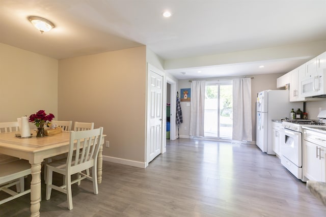 1025 Rte 47 S, Rio Grande, NJ 08204 - kitchen featuring white appliances, light wood-style flooring, white cabinetry, recessed lighting, and baseboards