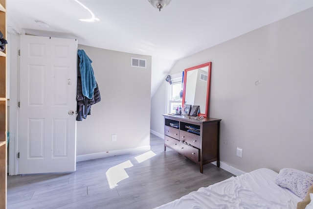 1025 Rte 47 S, Rio Grande, NJ 08204 - bedroom featuring baseboards, wood finished floors, and vaulted ceiling