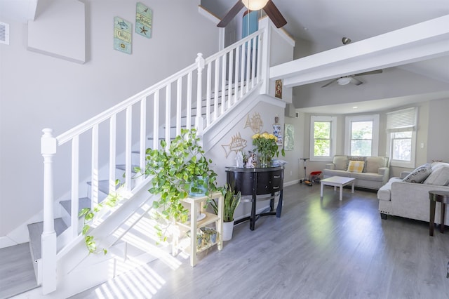 1025 Rte 47 S, Rio Grande, NJ 08204 - living area featuring ceiling fan, stairs, wood finished floors, and high vaulted ceiling