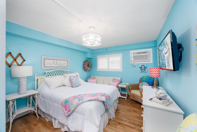 8401 Atlantic Ave Unit 310, Wildwood Crest, NJ 08260 - bedroom with a wall mounted AC and light wood-style flooring