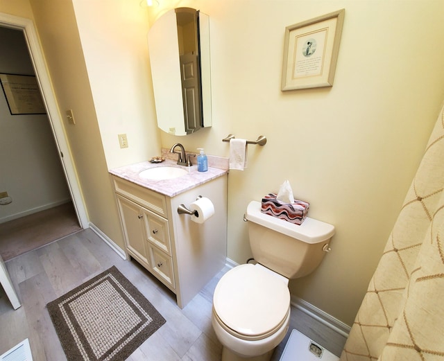 20 Summer Cir, North Cape May, NJ 08204 - bathroom with wood finished floors, toilet, vanity, and baseboards
