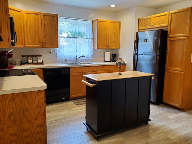 20 Summer Cir, North Cape May, NJ 08204 - kitchen featuring black appliances, a sink, light countertops, a kitchen island, and recessed lighting