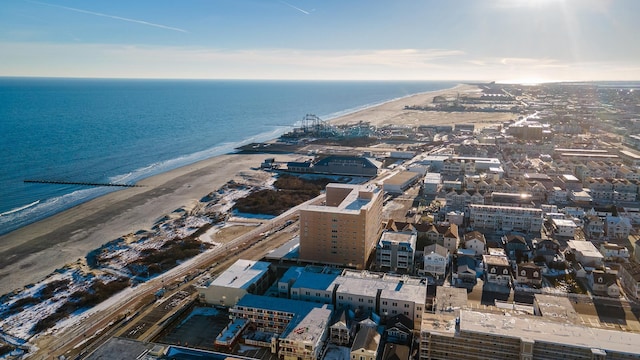 birds eye view of property with a water view and a view of the beach