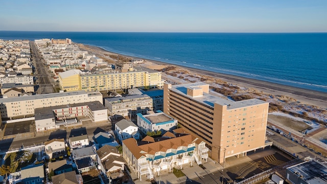 aerial view featuring a view of the beach and a water view