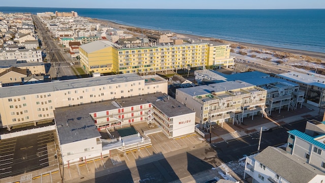 bird's eye view with a water view and a view of the beach