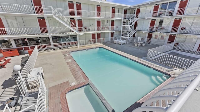 community pool featuring a patio area