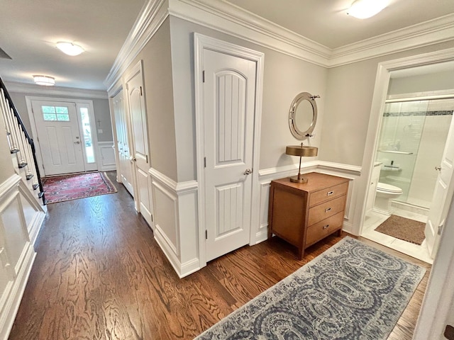 847 Broadway Unit 8, West Cape May, NJ 08204 - foyer featuring dark wood-style flooring, a decorative wall, crown molding, and a wainscoted wall