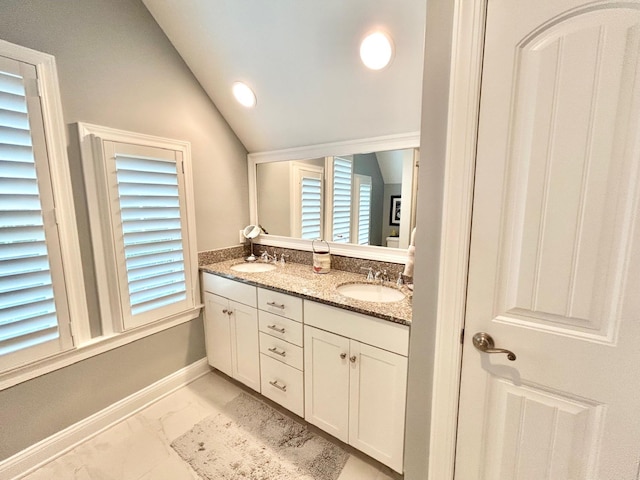 847 Broadway Unit 8, West Cape May, NJ 08204 - bathroom featuring marble finish floors, lofted ceiling, double vanity, baseboards, and healthy amount of natural light