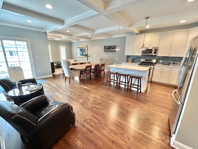 847 Broadway Unit 8, West Cape May, NJ 08204 - living area with baseboards, beamed ceiling, wood finished floors, coffered ceiling, and recessed lighting