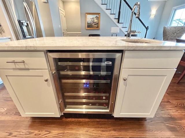 847 Broadway Unit 8, West Cape May, NJ 08204 - bar area featuring beverage cooler, a sink, dark wood-type flooring, stainless steel refrigerator with ice dispenser, and stairway