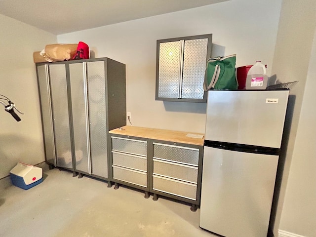 847 Broadway Unit 8, West Cape May, NJ 08204 - kitchen with freestanding refrigerator and concrete floors