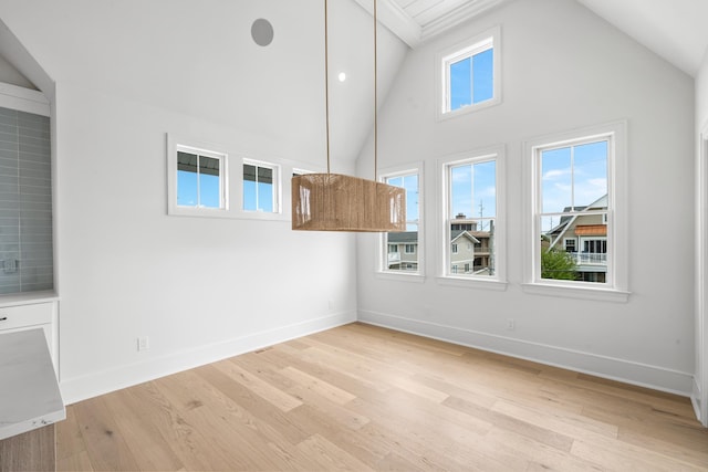 286 75th St, Avalon, NJ 08202 - additional living space featuring baseboards, light wood-type flooring, high vaulted ceiling, and beam ceiling
