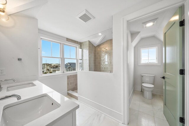 286 75th St, Avalon, NJ 08202 - bathroom with a walk in shower, toilet, lofted ceiling, marble finish floors, and double vanity