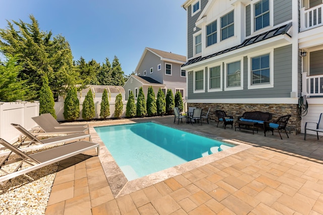 149 10th St, Avalon, NJ 08202 - view of swimming pool featuring a patio, outdoor lounge area, and a fenced backyard