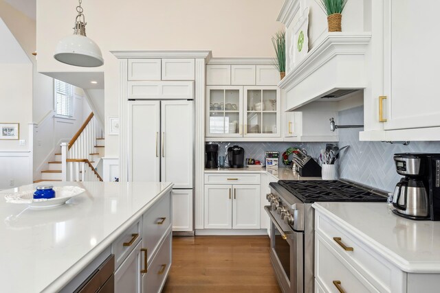 149 10th St, Avalon, NJ 08202 - kitchen featuring high quality appliances, light countertops, backsplash, white cabinetry, and a towering ceiling