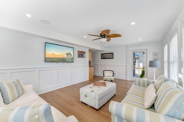 149 10th St, Avalon, NJ 08202 - living room with recessed lighting, wainscoting, ceiling fan, light wood finished floors, and a decorative wall