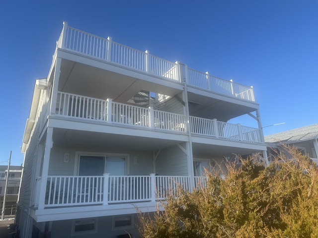 back of house with a balcony