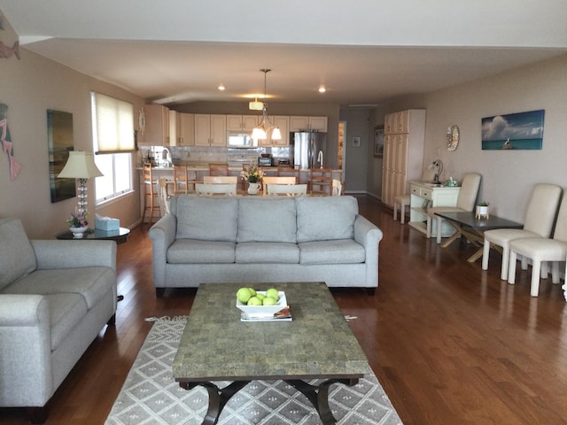 living room with dark hardwood / wood-style floors