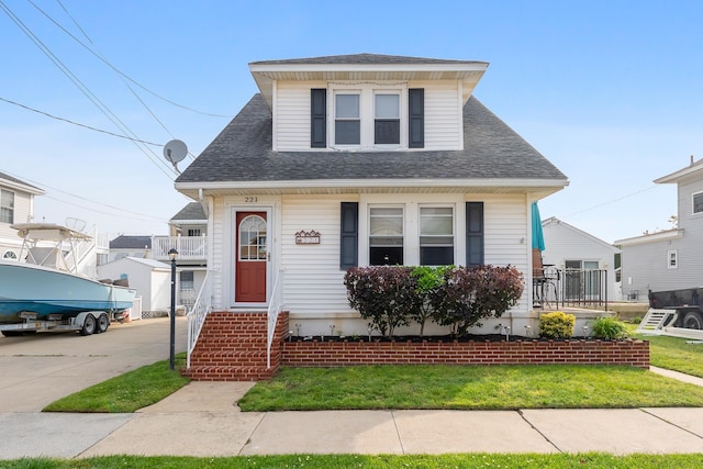 221 W 25th Ave, North Wildwood, NJ 08260 - bungalow-style home featuring a shingled roof and entry steps