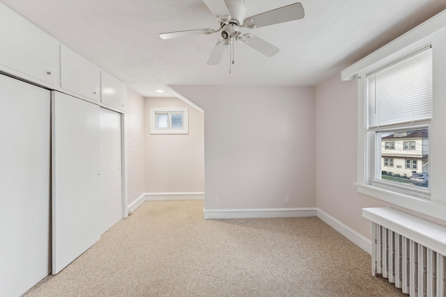 221 W 25th Ave, North Wildwood, NJ 08260 - unfurnished bedroom with radiator heating unit, light carpet, a closet, and a ceiling fan