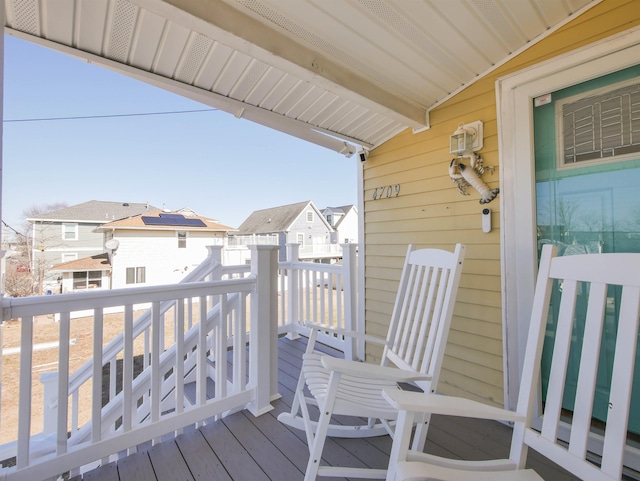 wooden terrace with a residential view