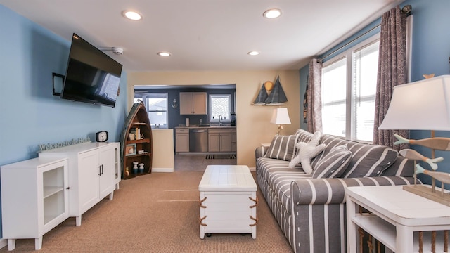 living room with light carpet and recessed lighting