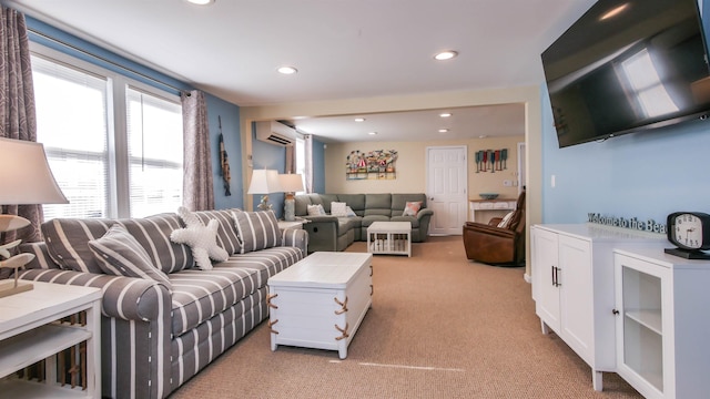 living area with recessed lighting, light colored carpet, and a wall mounted AC
