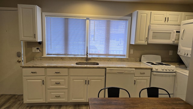 kitchen featuring sink, dark wood-type flooring, white cabinets, and white appliances