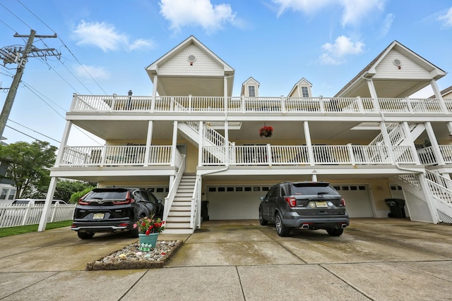 3102 Ocean Ave Unit G, Wildwood, NJ 08260 - raised beach house featuring stairs, an attached garage, and concrete driveway