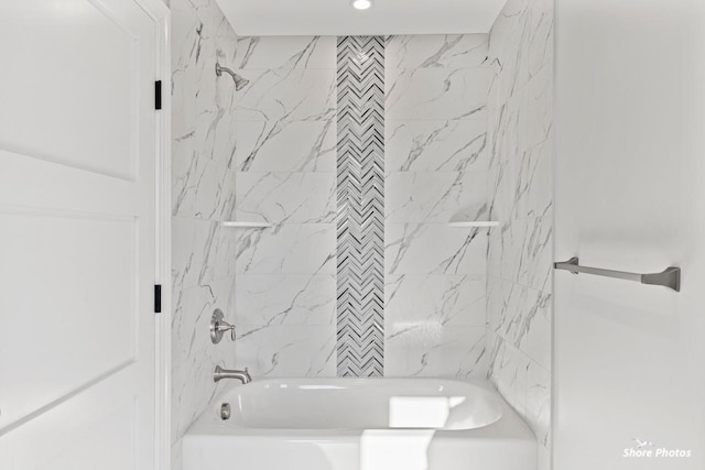 bathroom featuring shower / washtub combination and recessed lighting