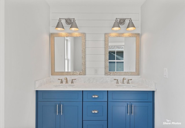 bathroom with double vanity and a sink