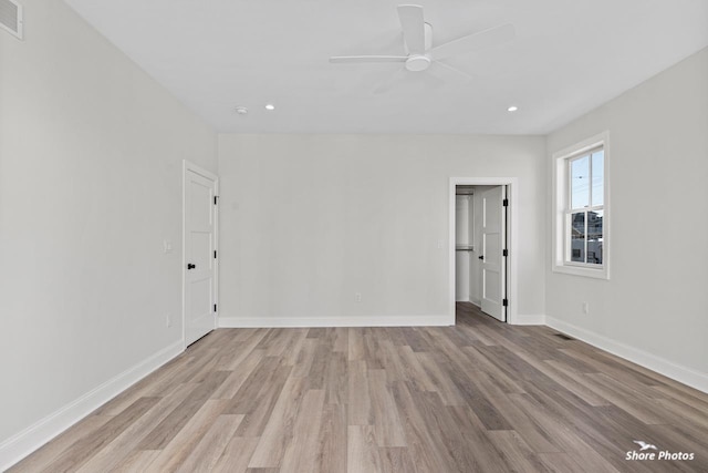 empty room featuring recessed lighting, visible vents, ceiling fan, light wood-type flooring, and baseboards