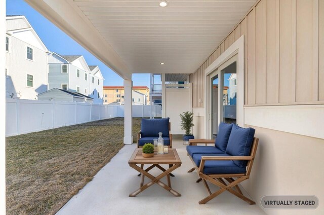 view of patio featuring fence and outdoor lounge area