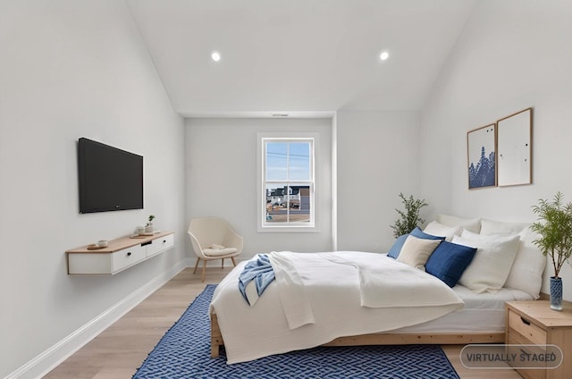 bedroom with lofted ceiling, baseboards, light wood finished floors, and recessed lighting