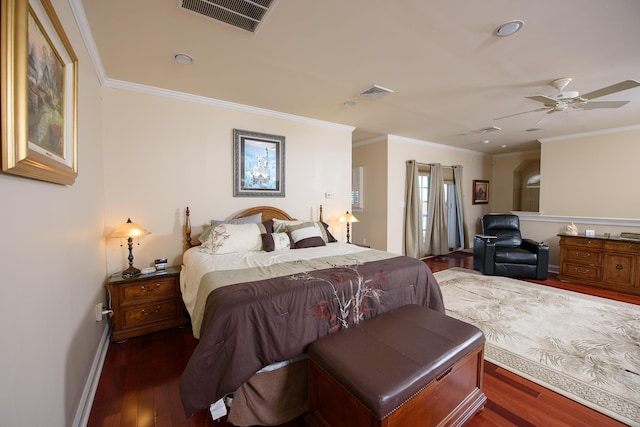 bedroom featuring dark hardwood / wood-style floors, ceiling fan, and crown molding