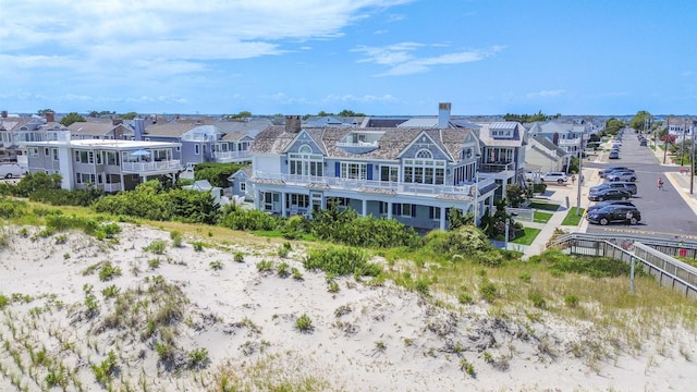 birds eye view of property with a residential view