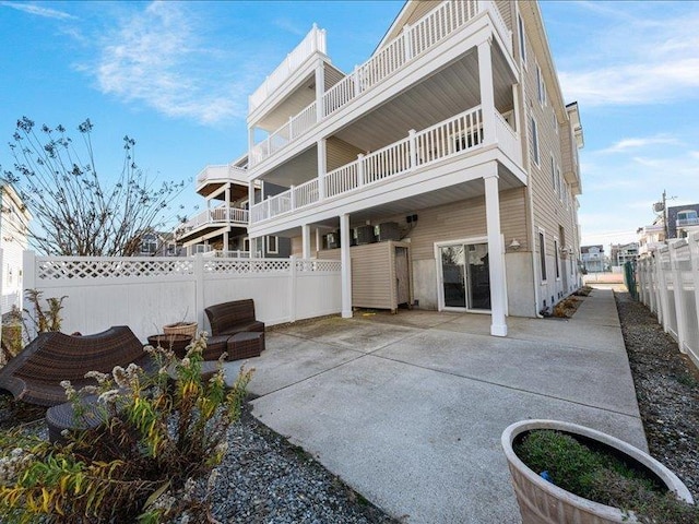 rear view of property featuring a patio