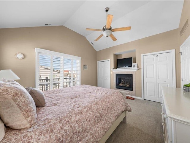 carpeted bedroom featuring ceiling fan and lofted ceiling