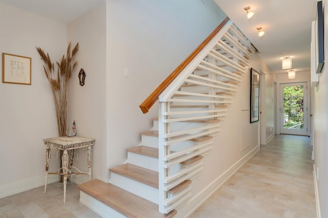 312 S Lake Dr, Cape May Point, NJ 08212 - stairway featuring baseboards