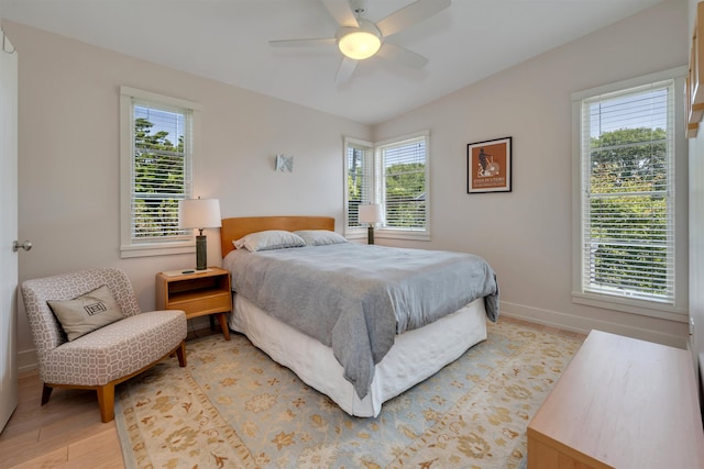 312 S Lake Dr, Cape May Point, NJ 08212 - bedroom with multiple windows, light wood-style flooring, and ceiling fan