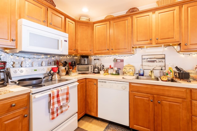 kitchen featuring sink and white appliances