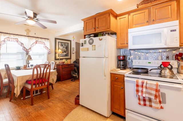 kitchen with white appliances, light hardwood / wood-style flooring, and ceiling fan