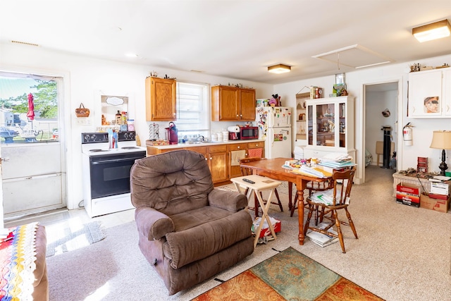 kitchen featuring white appliances and sink