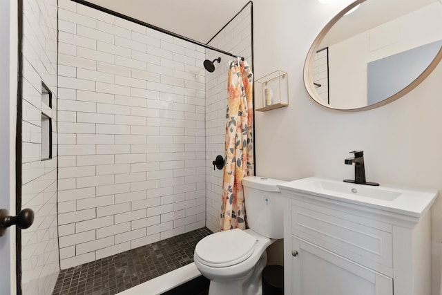 bathroom featuring a shower with shower curtain, vanity, and toilet