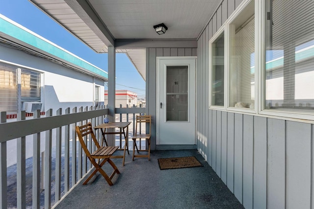 entrance to property featuring a balcony