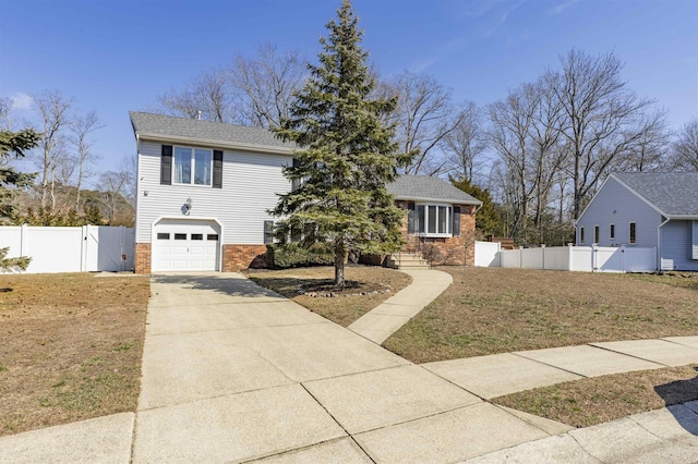 view of front of property with a gate, fence, concrete driveway, an attached garage, and brick siding