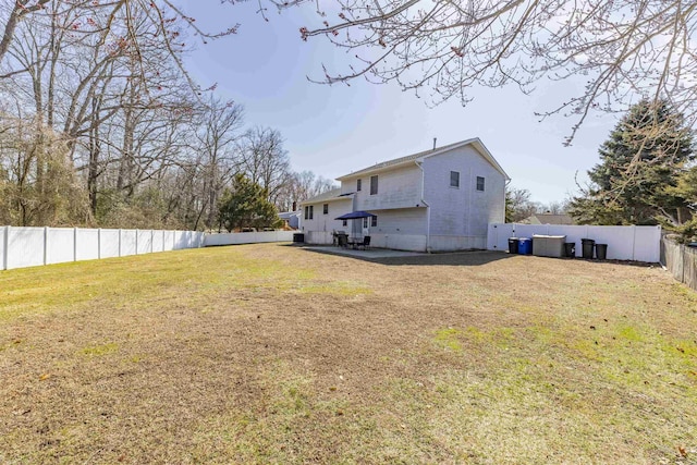 view of yard with a patio area and a fenced backyard