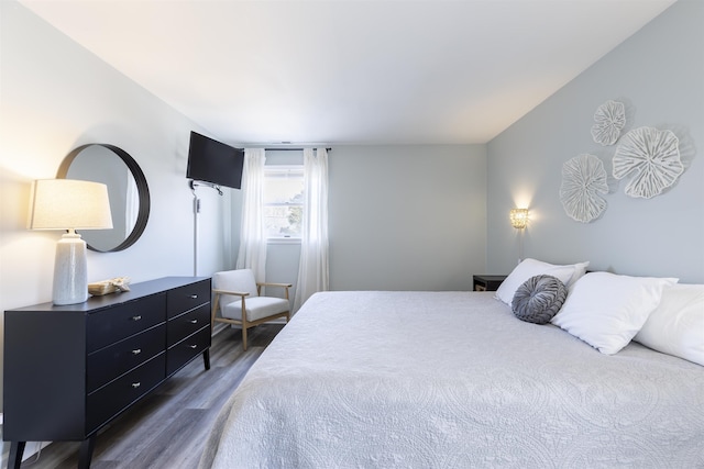 bedroom with wood finished floors