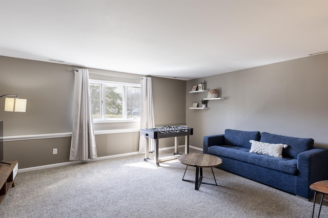 carpeted living room with visible vents and baseboards